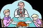 family praying for thanksgiving meal